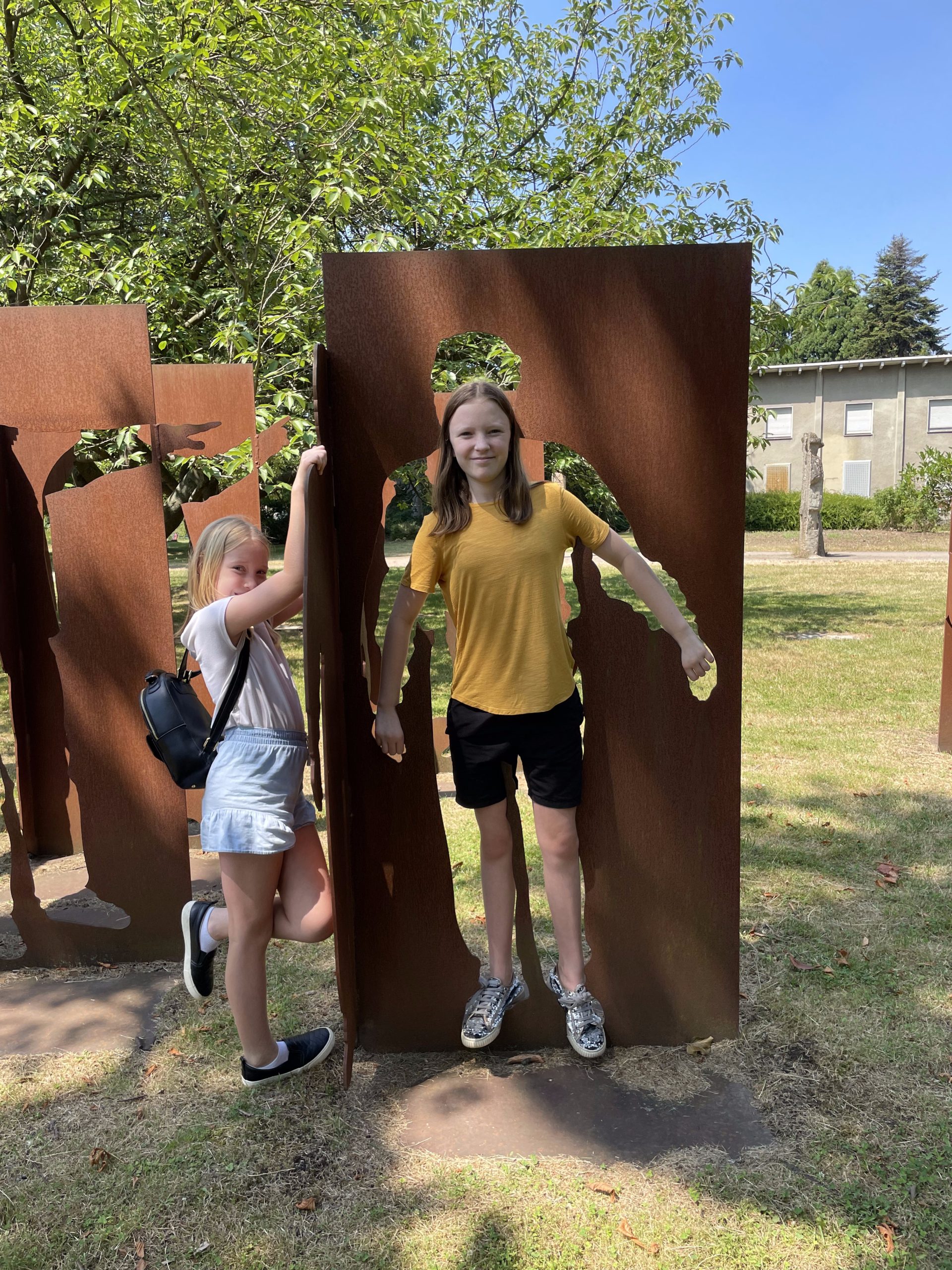 The girls pose with some art cutouts